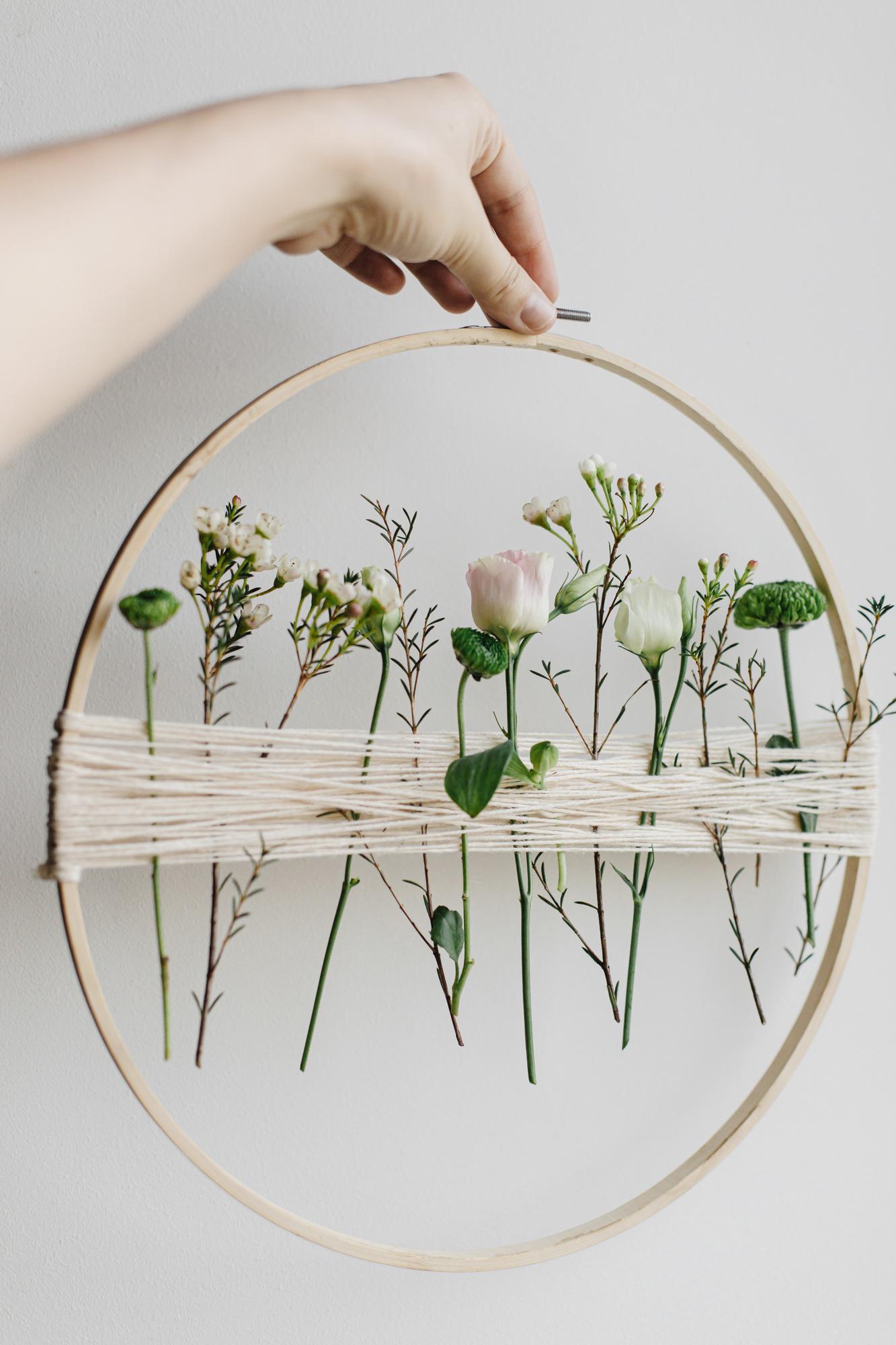 Close-up of handmade embroidery hoop with floral design